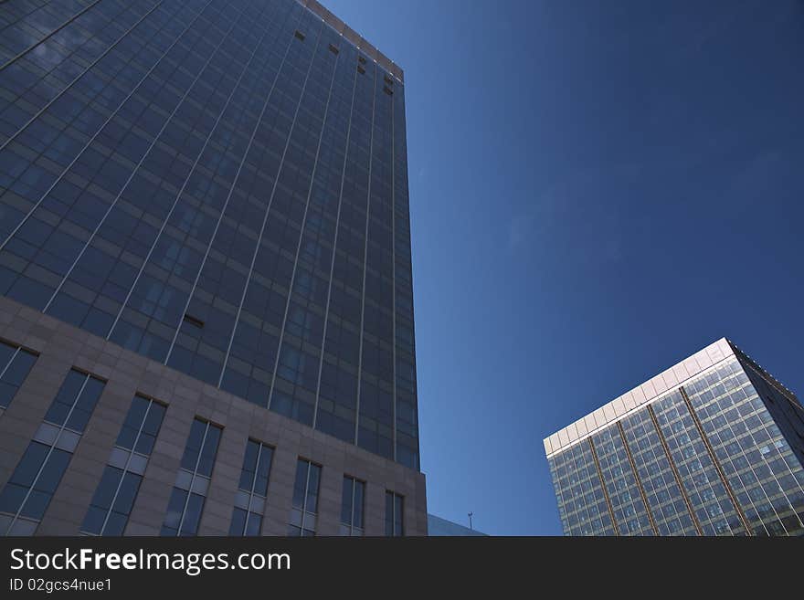 The modern office buildings on blue sky background