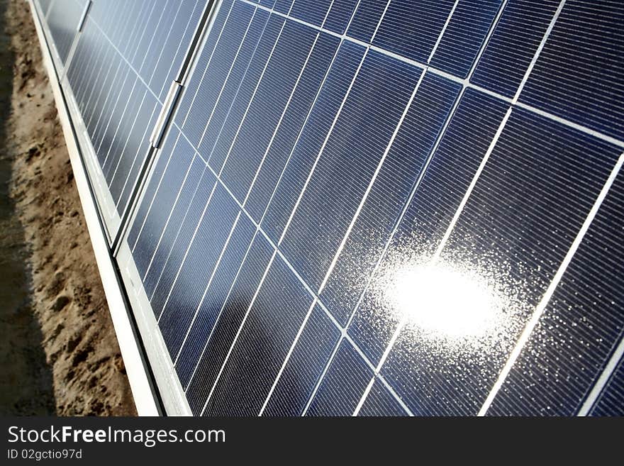 Modern solar photo voltaic panel close up with great blue cells details in a perspective view. Great for energy and environment themes.