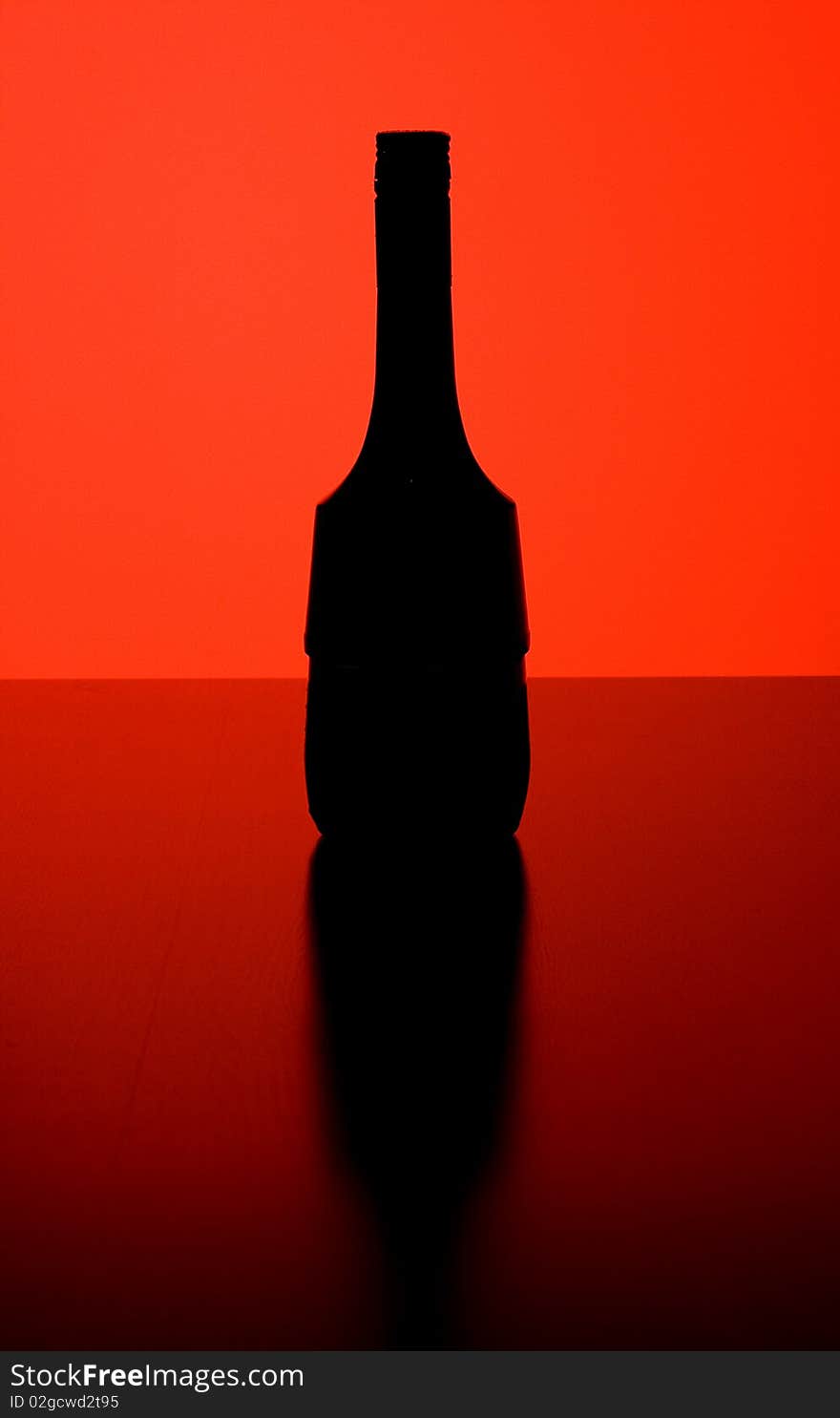 Black bottle with red background