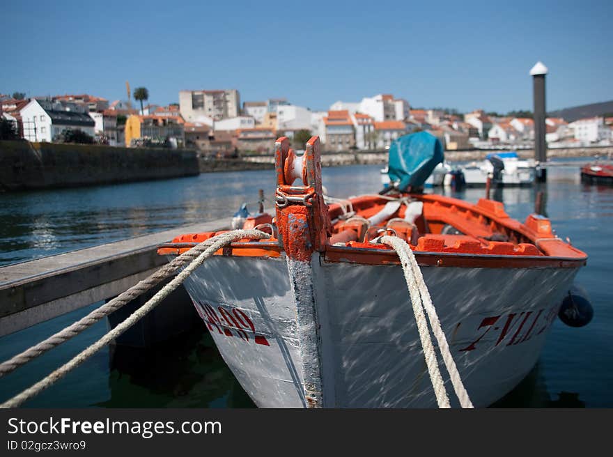 Wooden fishing boat moored floating dock