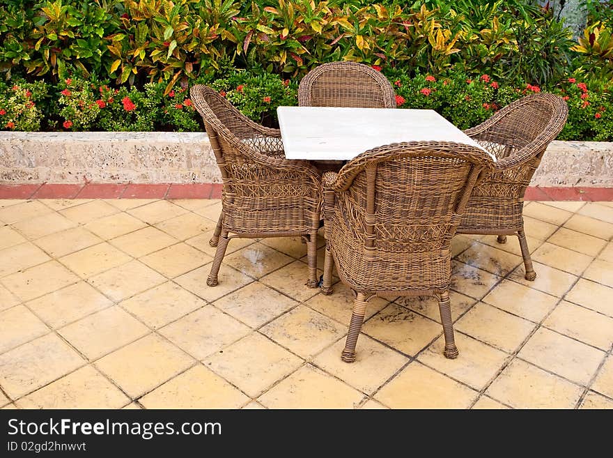 Brown Wooden Chairs An Tables On Patio