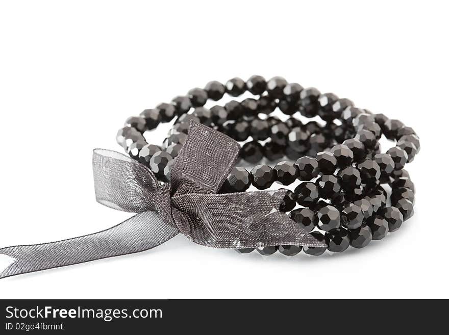 Black bracelet on white background