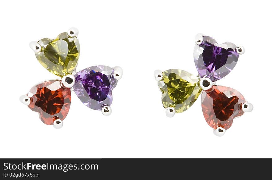 Coloured earrings on white background