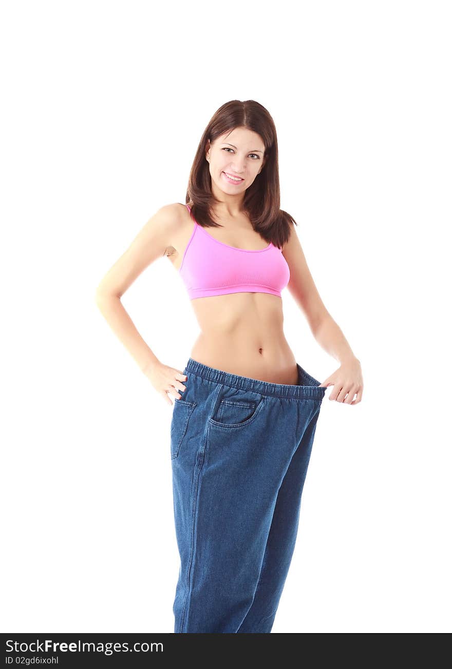 View of female became skinny and wearing old jeans. View of female became skinny and wearing old jeans