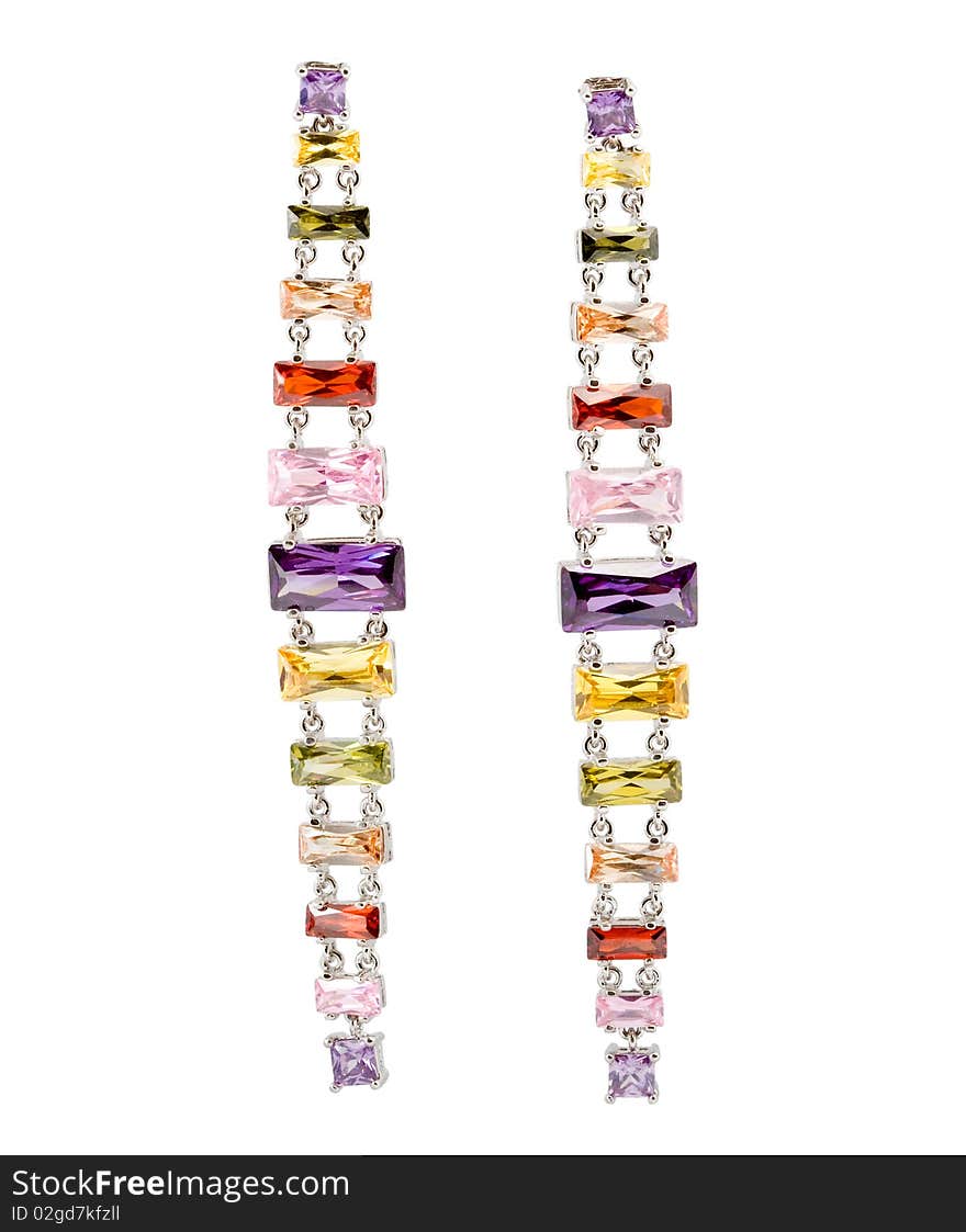 Coloured earrings on white background