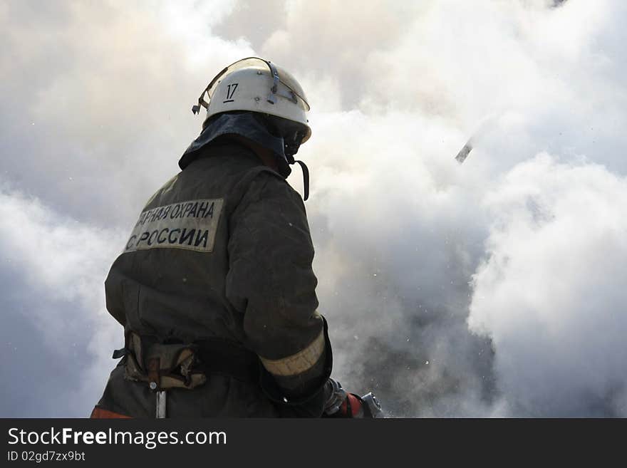 Firefighter extinguishes a forest fire. Firefighter extinguishes a forest fire