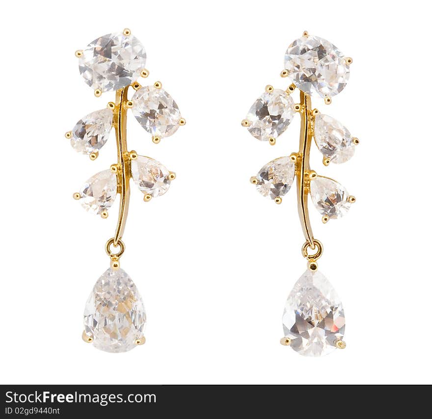 Golden earrings on white