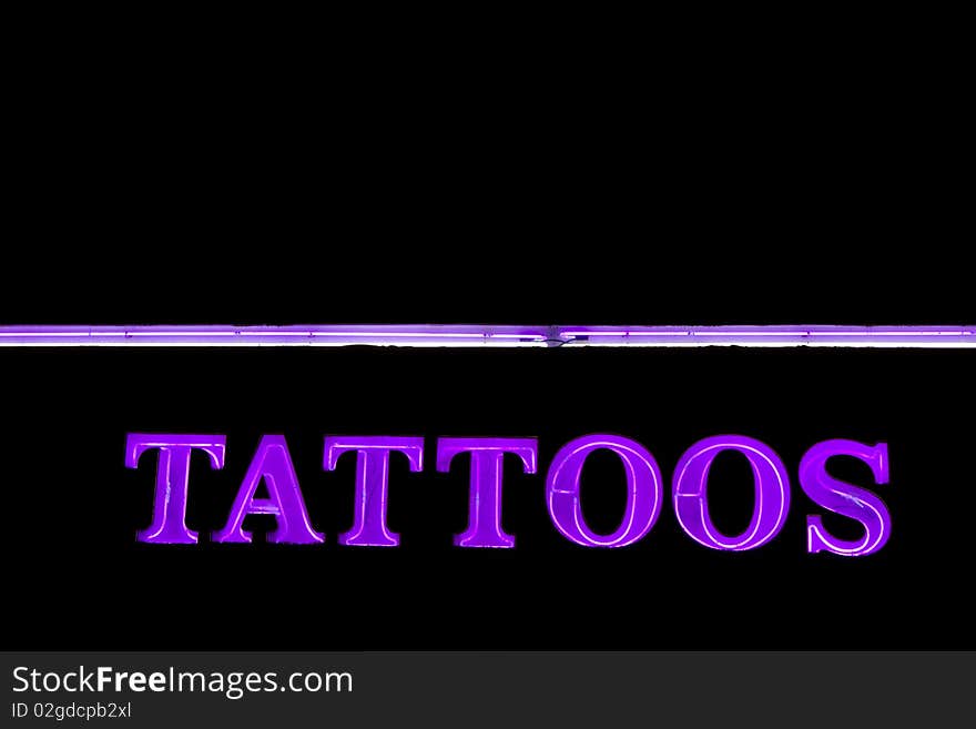 Neon sign TATTOOS for tattoos salon at the night