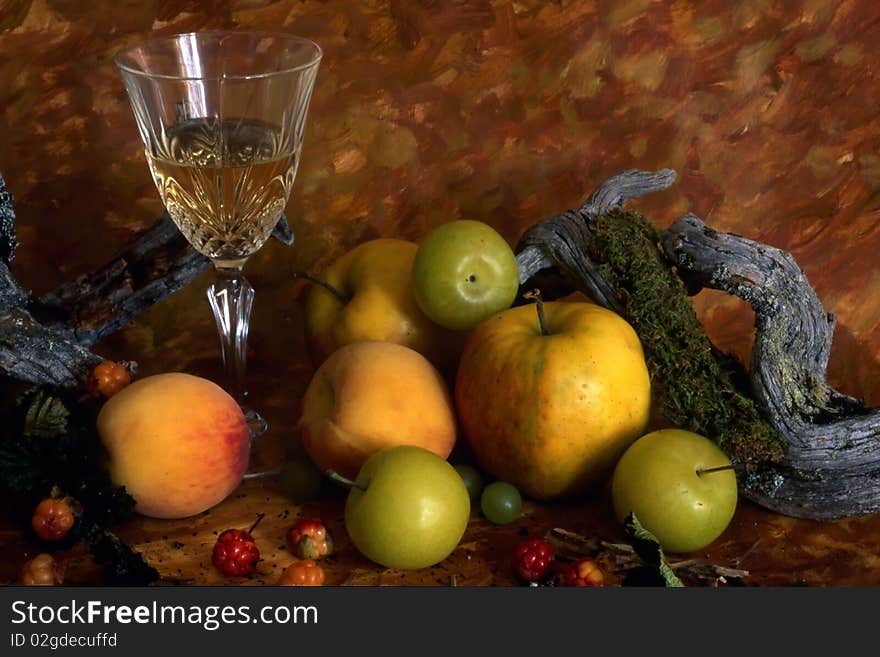 White wine and fruits isolated on painted background