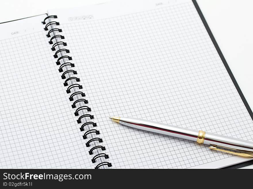 Close-up Of Pen And Note On Table.