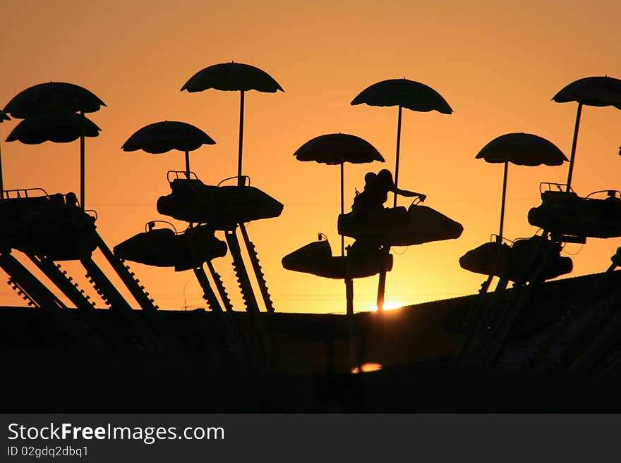 Interesting shapes given by a merry-go-round when the sun is setting