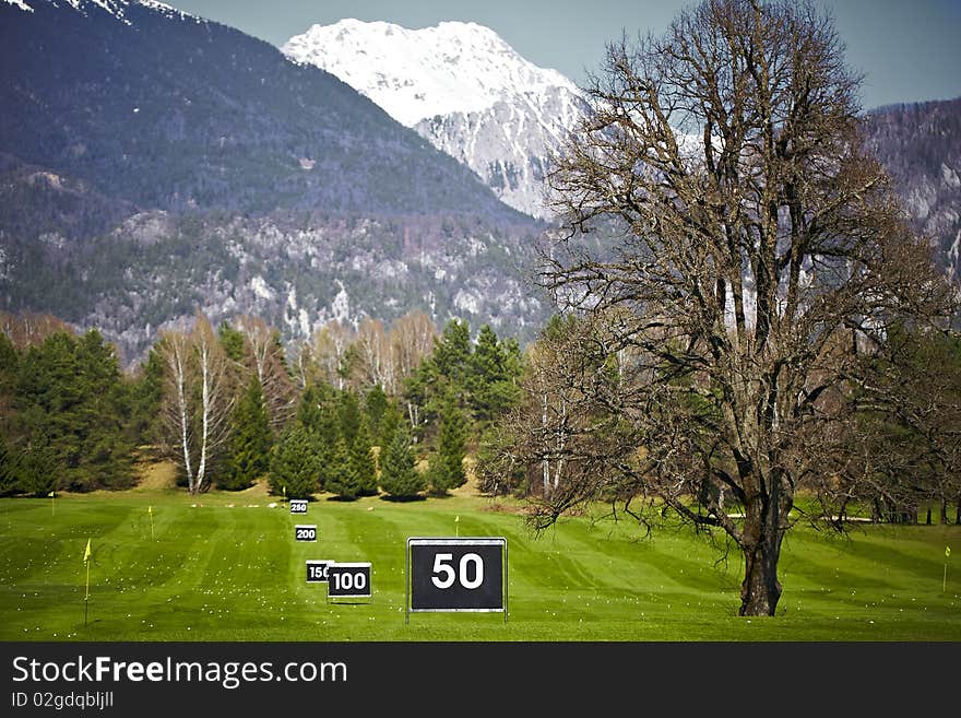 Driving range for far golf swing, practice.