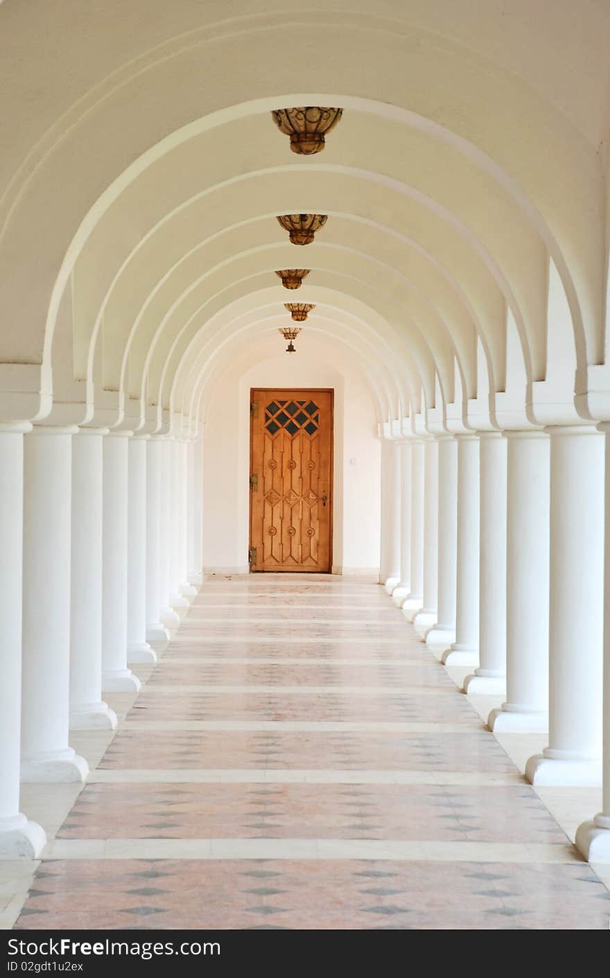 A row of white columns in a romanian monastery. A row of white columns in a romanian monastery