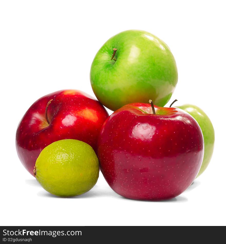 Large red and green apples with lime on the isolated background