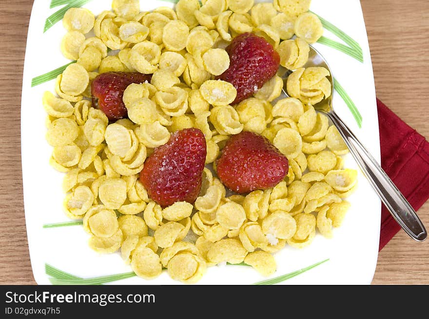 Crunchy tasty cereals with fresh organic strawberries