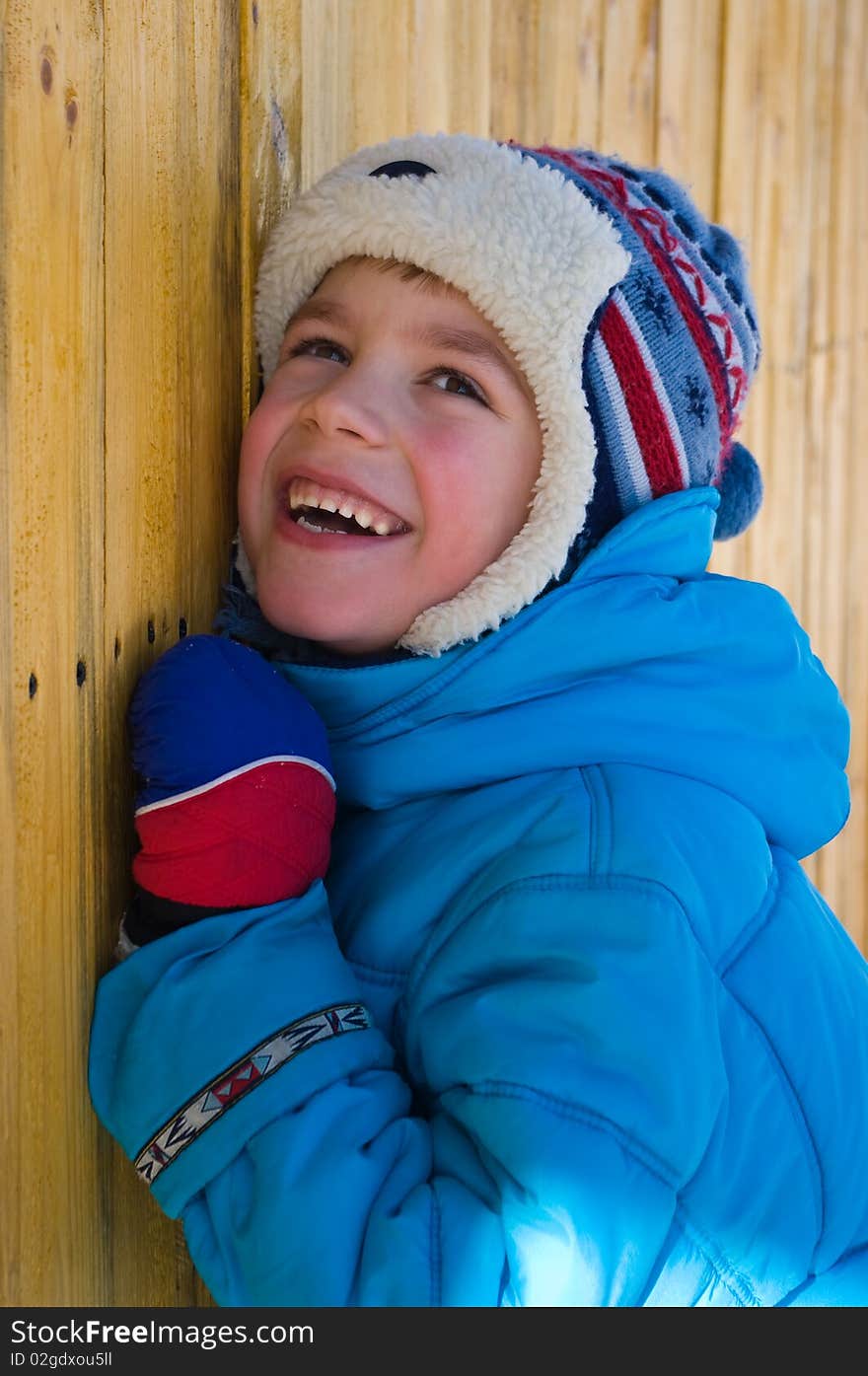 Portrait of a smiling boy in warm clothing