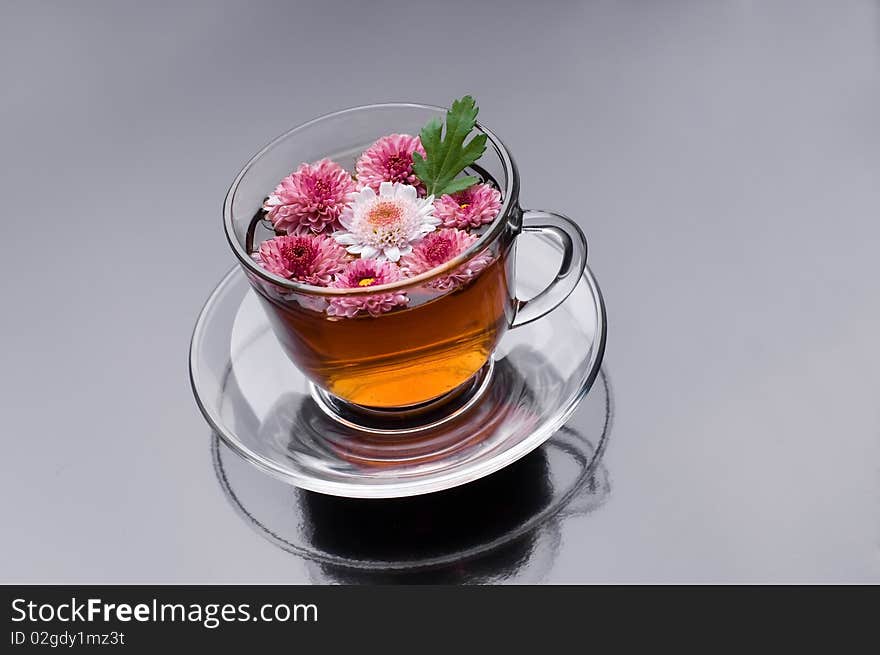 Cup of herbal tea with flowers