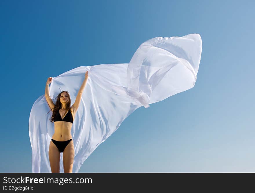 Woman with white material and nature