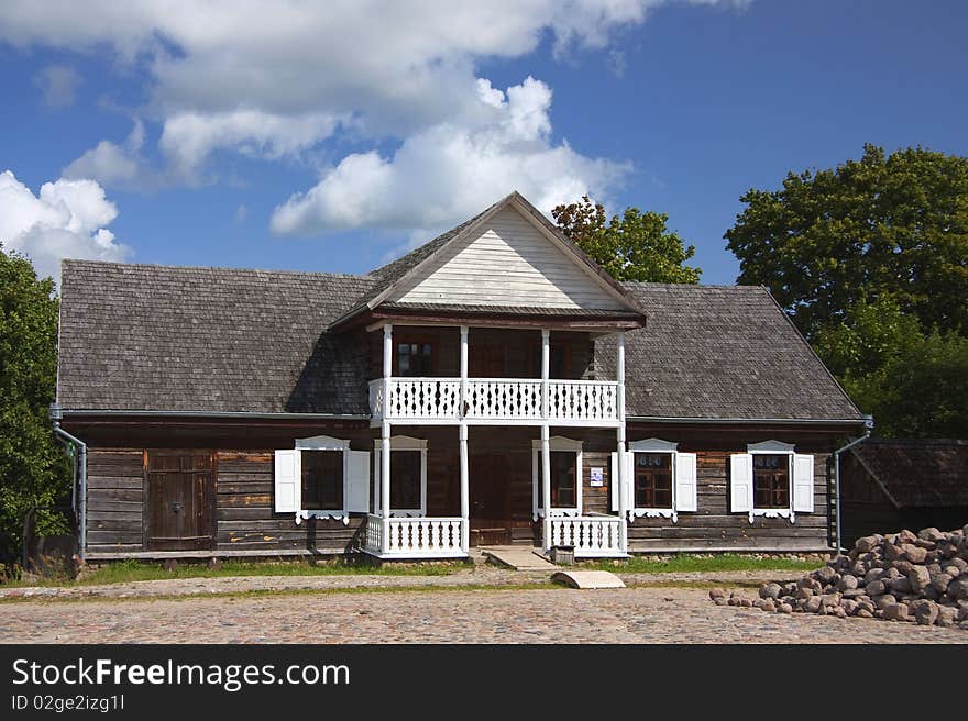 Old wooden country house, blue sky. Old wooden country house, blue sky