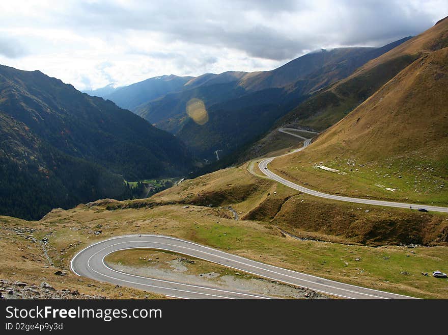 The road from the lake Balea Lac (in the mountains of Romania - region Fagarasi) to south. The road is also named Transfagarasean and was visited/tested by TopGear team;. The road from the lake Balea Lac (in the mountains of Romania - region Fagarasi) to south. The road is also named Transfagarasean and was visited/tested by TopGear team;