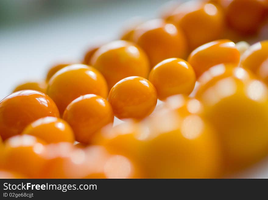 Amber chaplet macro with sparkles of light on the