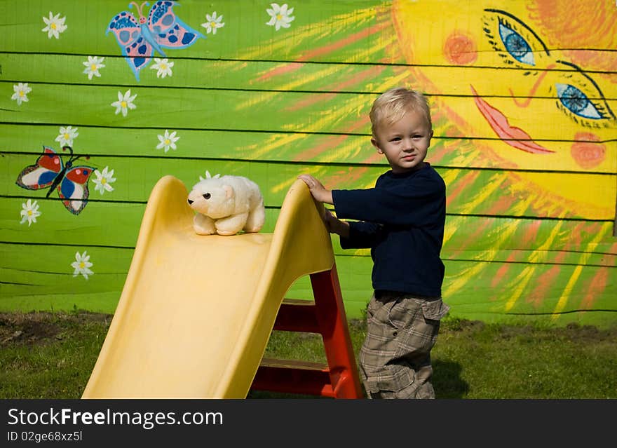 The little boy near a hill. The little boy near a hill.