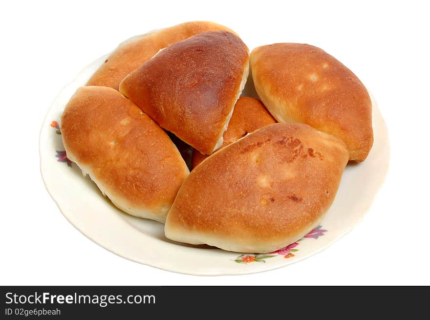 Baked pies on a plate