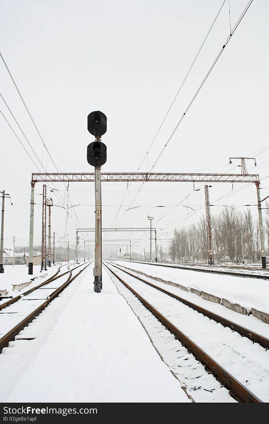 Traffic light between two railways. Traffic light between two railways