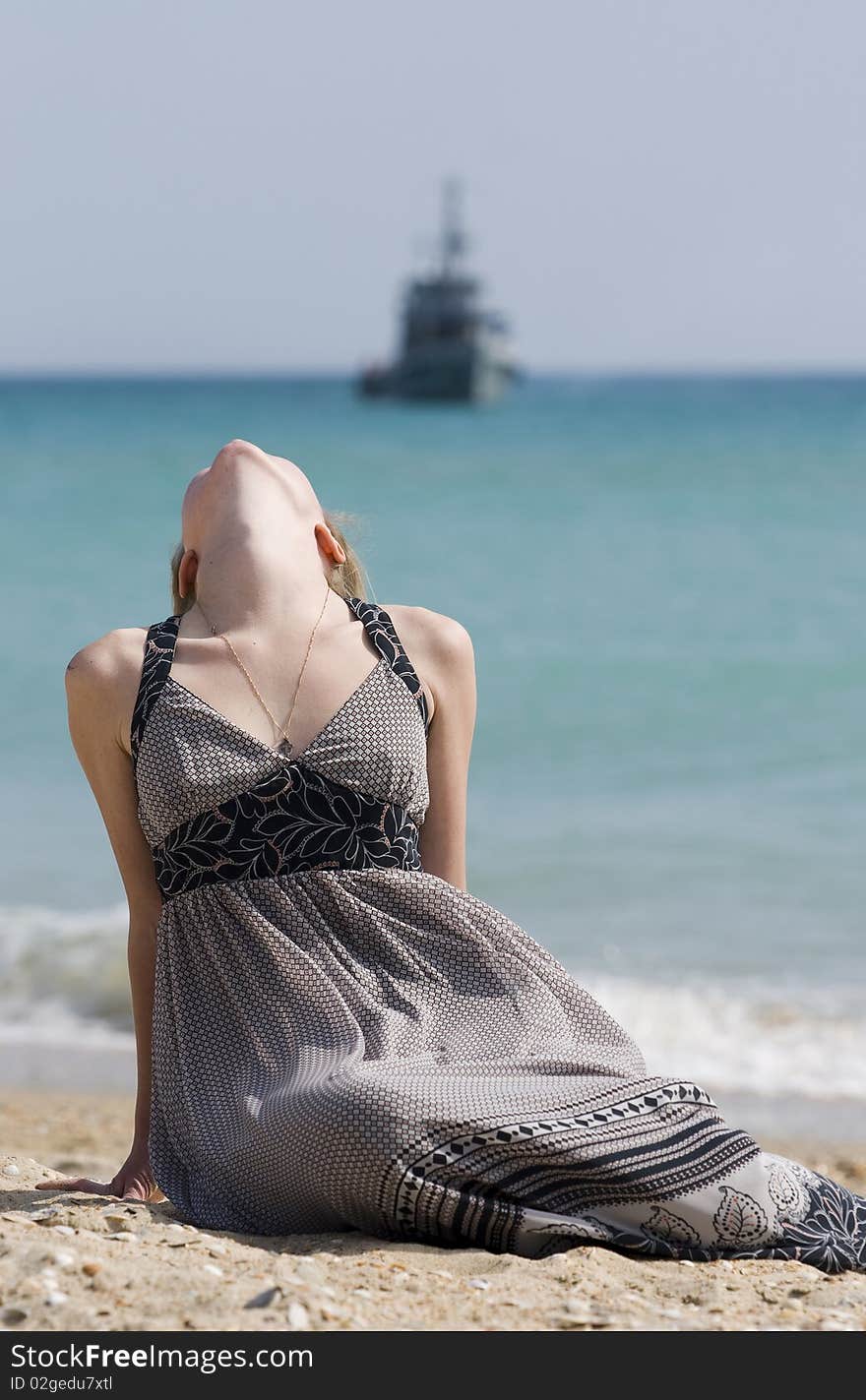 The girl thrown back a head against the ship. The girl thrown back a head against the ship