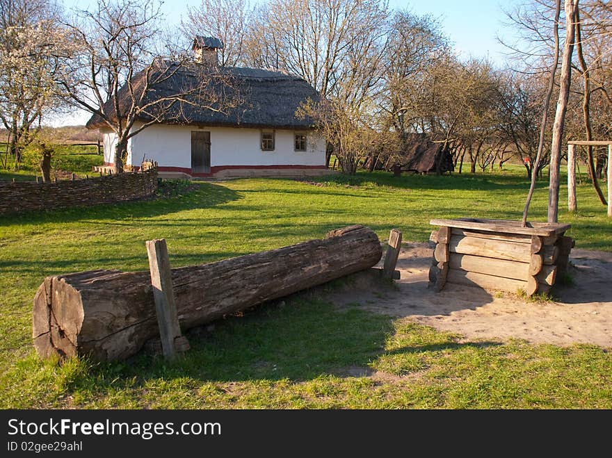 The old Ukrainian house with a well. The old Ukrainian house with a well