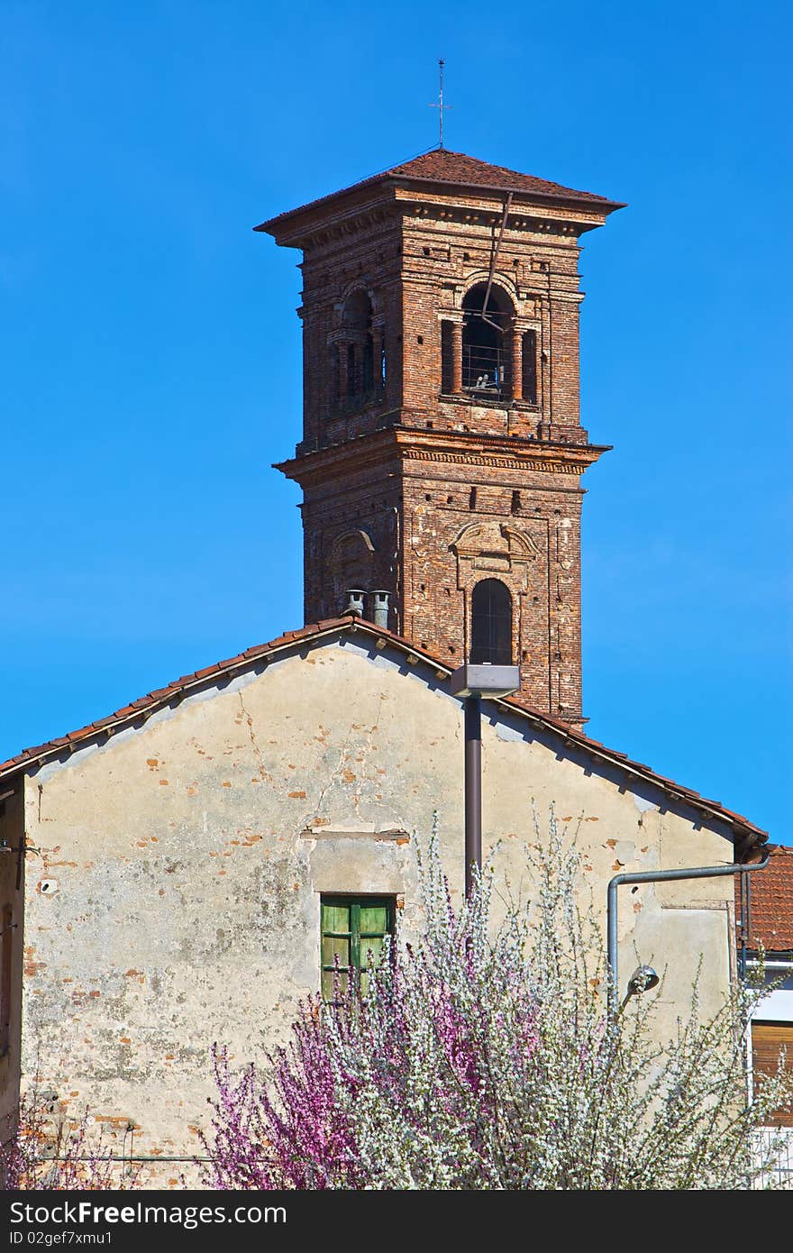 The church tower of the city of Carmagnola, Turin, Italy. The church tower of the city of Carmagnola, Turin, Italy