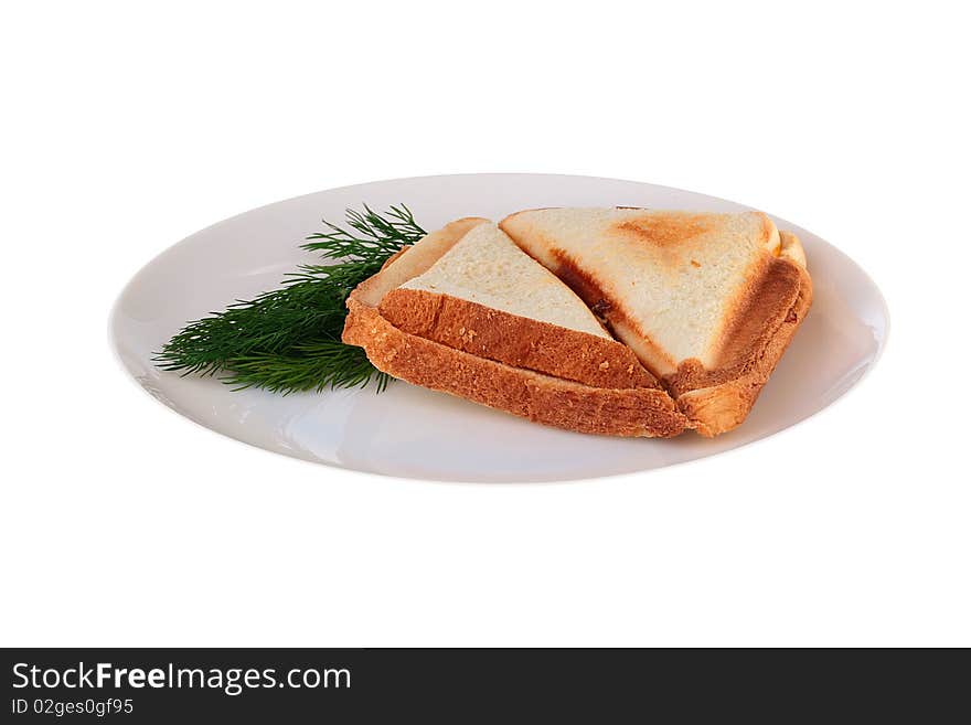 The hot sandwich is prepared in a roaster on a plate together with a fennel branch.