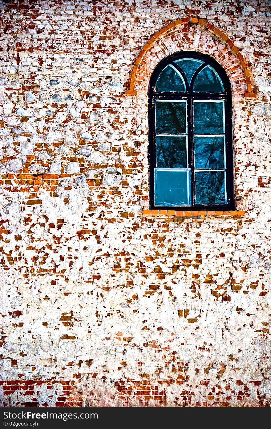 Discarded ruin with old windows and wall, industrial window in concrete wall