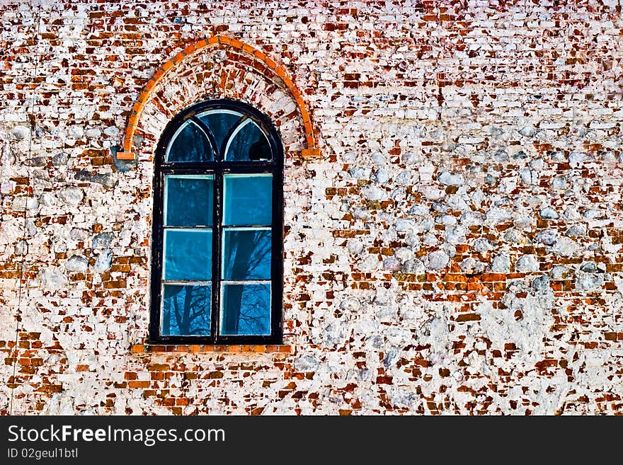 Discarded ruin with old windows and wall, industrial window in concrete wall