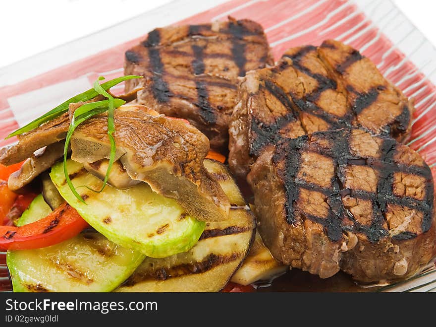 Plate with beefs fillet on white background. Plate with beefs fillet on white background