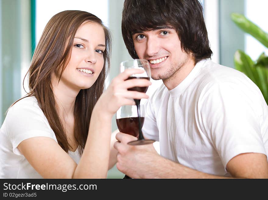 Beautiful girl and boy with wineglasses