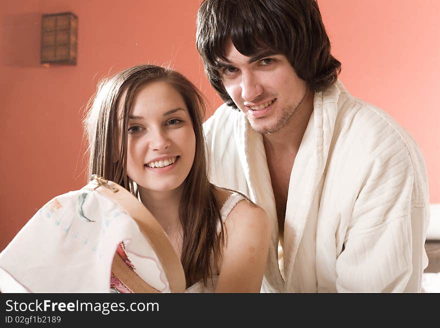 Boy in white dressing gown and girl with smile