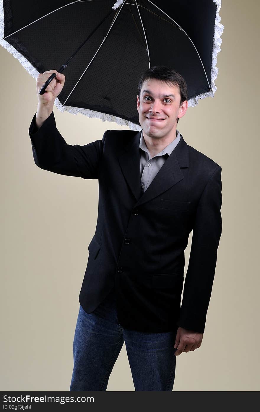 Funny business man challenging with umbrella