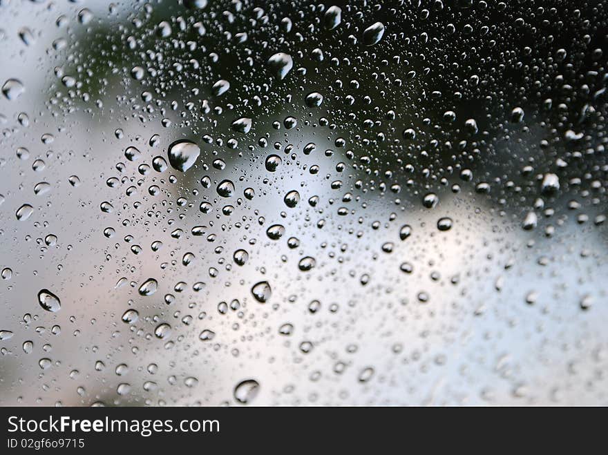 Photo of water droplet on clear glass