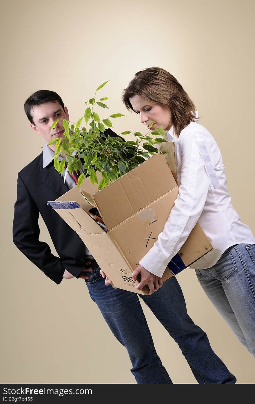 White depressed woman leaving her business life and upset manager in background. White depressed woman leaving her business life and upset manager in background