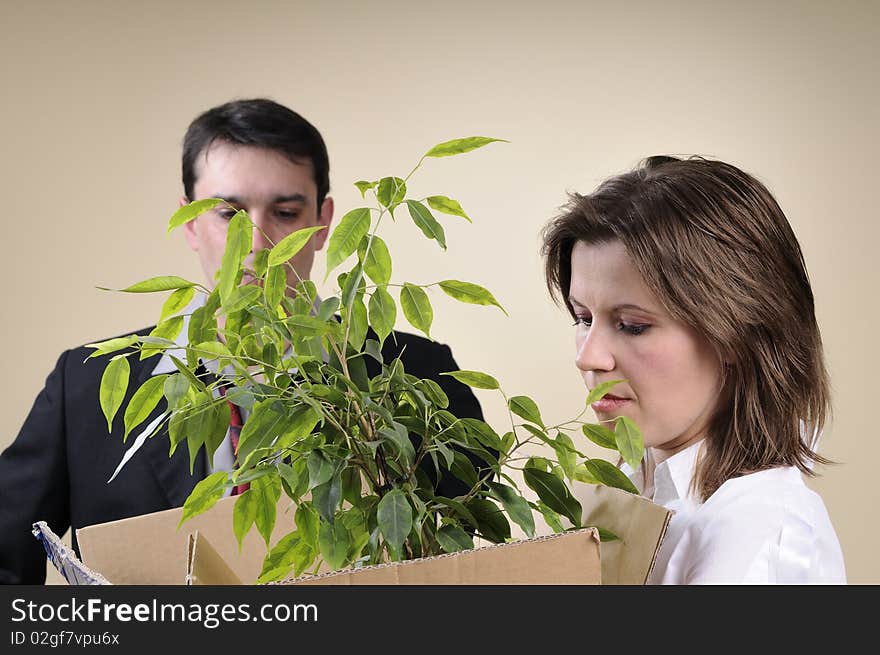 White depressed woman leaving her business life and upset manager in background. White depressed woman leaving her business life and upset manager in background