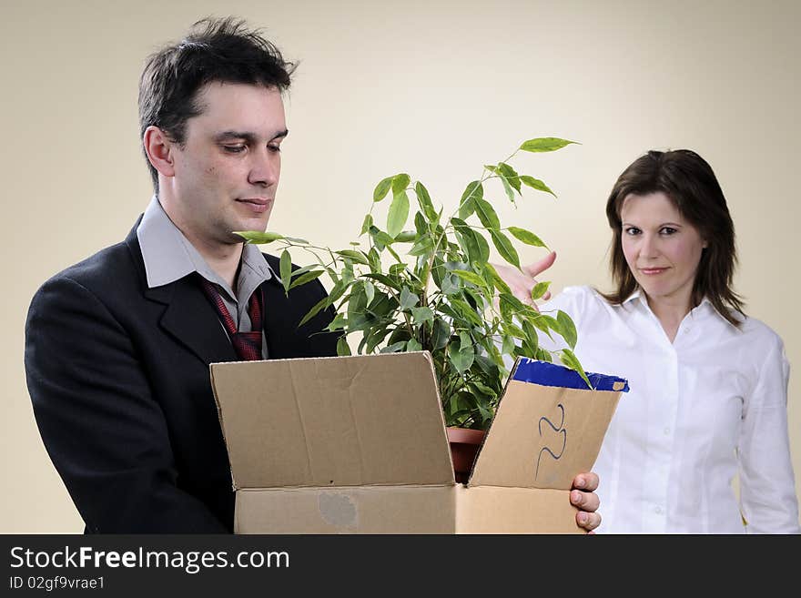 Cheerful business woman for her fired colleague leaving office. Cheerful business woman for her fired colleague leaving office