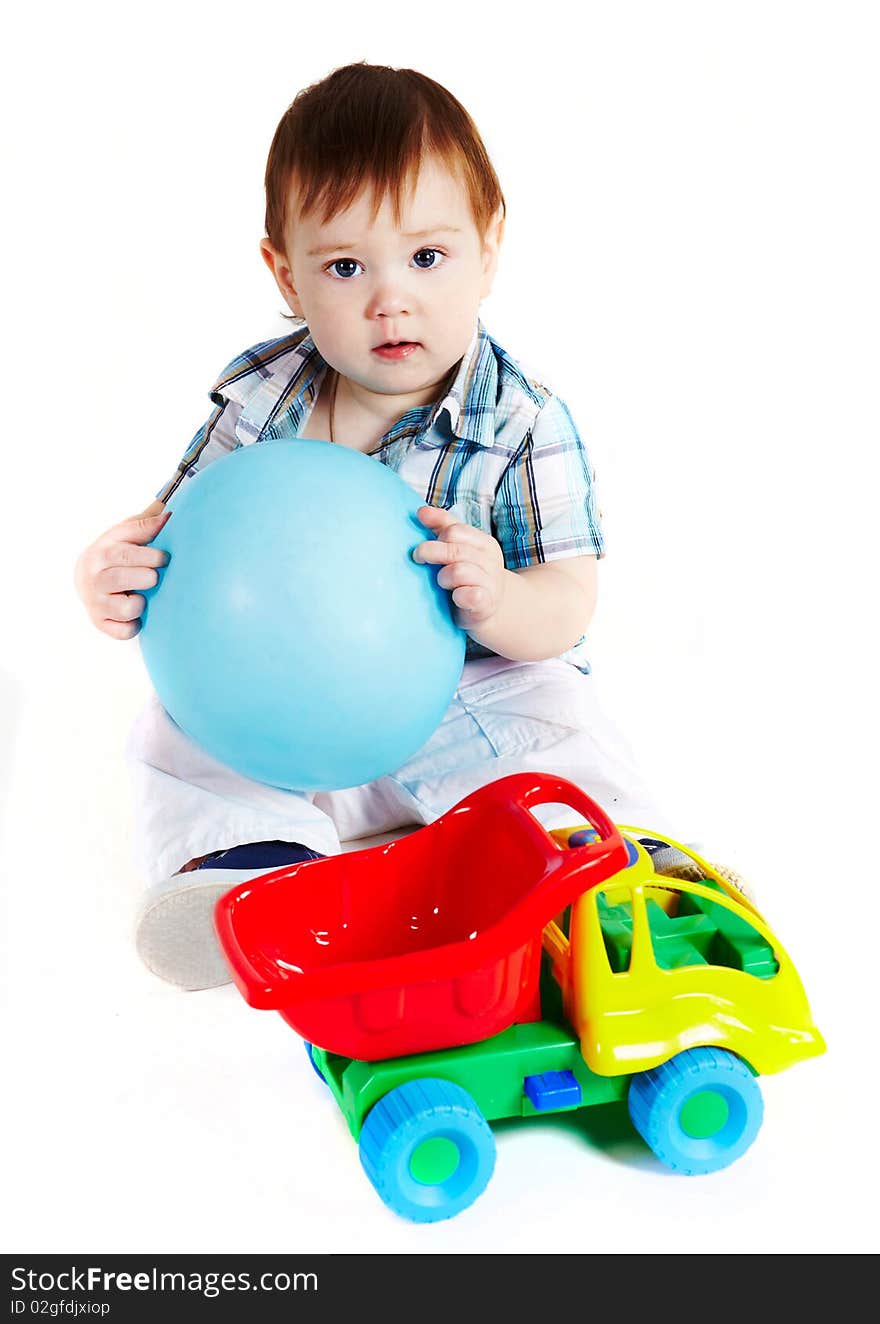 Boy with baloon and toy truck