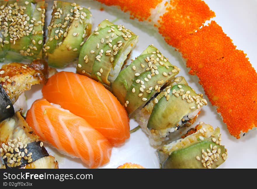 Close-up Japanese colourful sushi set on a white plate. Close-up Japanese colourful sushi set on a white plate