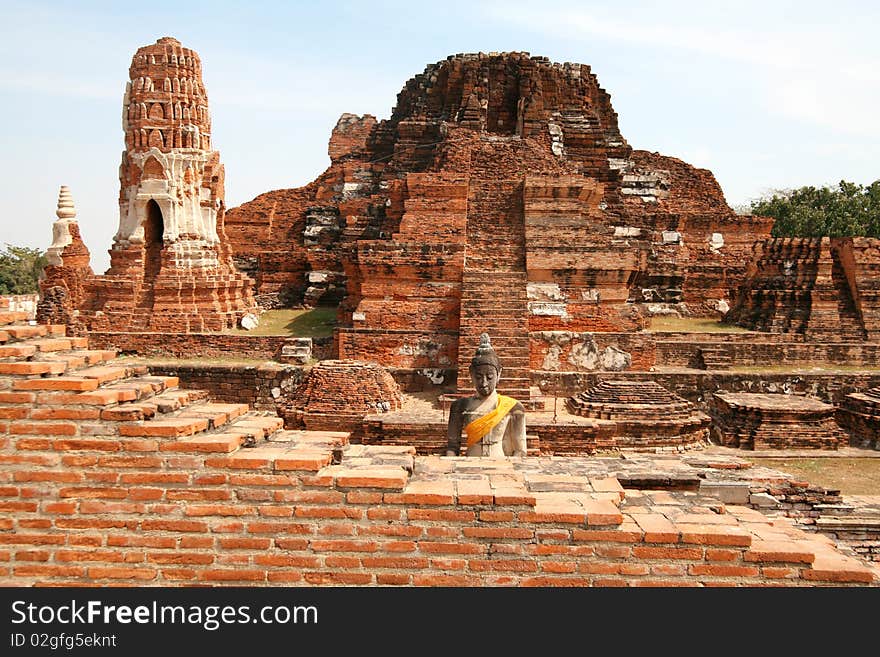 Ruins the temple of Wat Mahatat and Buddha in Ayutthaya near Bangkok, Thailand. Ruins the temple of Wat Mahatat and Buddha in Ayutthaya near Bangkok, Thailand