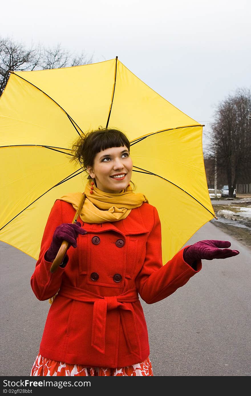 Beautiful girl on red coat with yellow. Beautiful girl on red coat with yellow