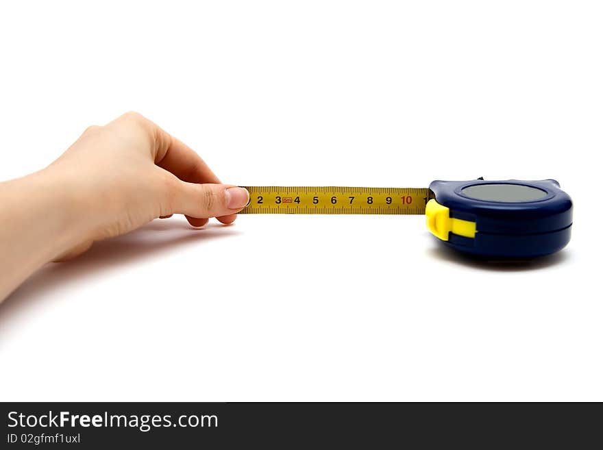 A tape measure with a hand holding it, isolated on white background. A tape measure with a hand holding it, isolated on white background