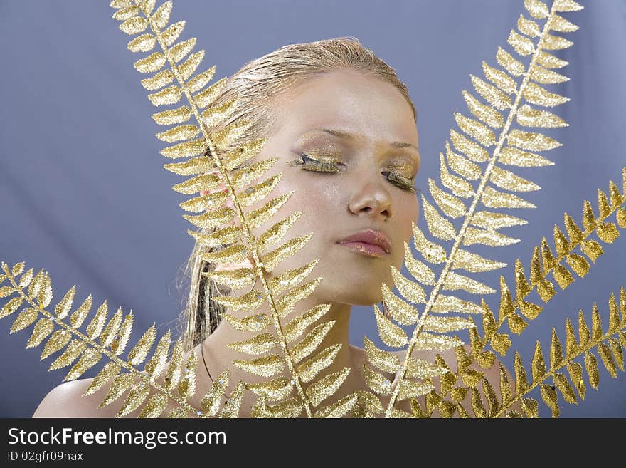 Beautiful woman with golden make up - Close up portrait of a beautiful female model - eos 1ds mkII. Beautiful woman with golden make up - Close up portrait of a beautiful female model - eos 1ds mkII