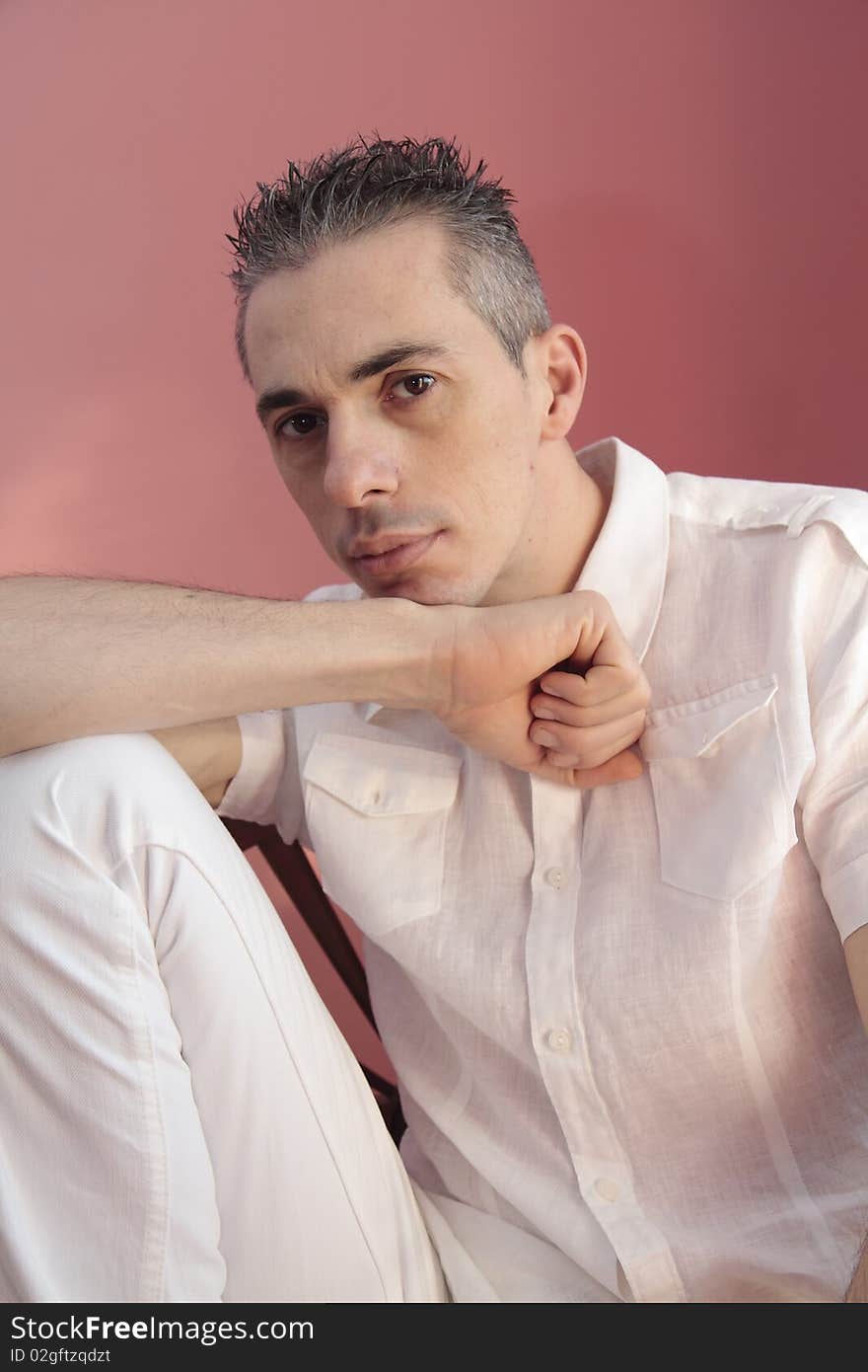 Man posing in front of the lens with a dreamy expression particularly