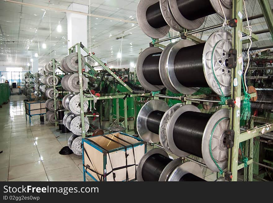 Automated textile machine and textile staff  in 
Textile Workshop , taken in china